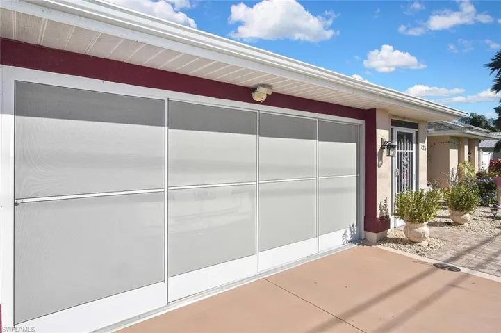 View of garage with the triple-screen outer door.