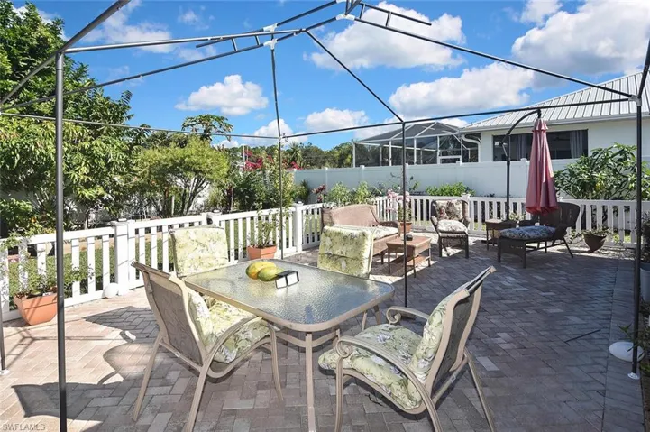 This gorgeous and oversized pavered patio has low gated fencing, perfect for keeping an eye on children or pets.