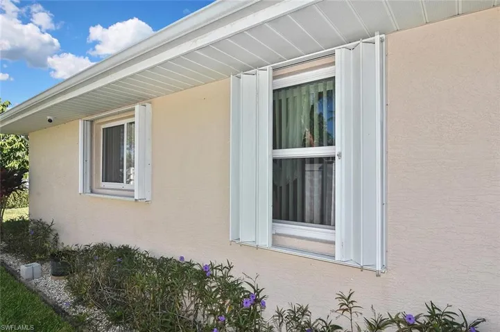Even with impact-rated windows, the addition of accordion-style hurricane shutters adds an extra level of storm protection!