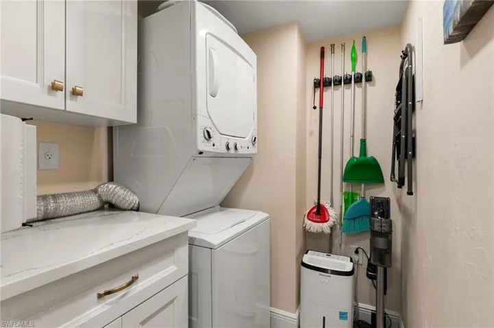 Originally laundry was in the kitchen, now relocated to its own separate laundry room with pocket door