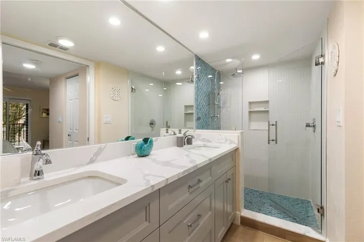 Dual sinks, lots of under sink cabinet space, beautifully remodeled shower