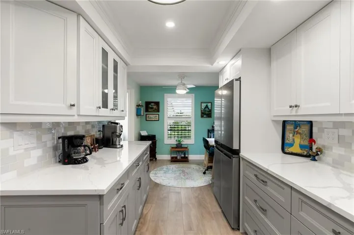 High end kitchen remodel, beautiful backsplash, extended left side cabinet area