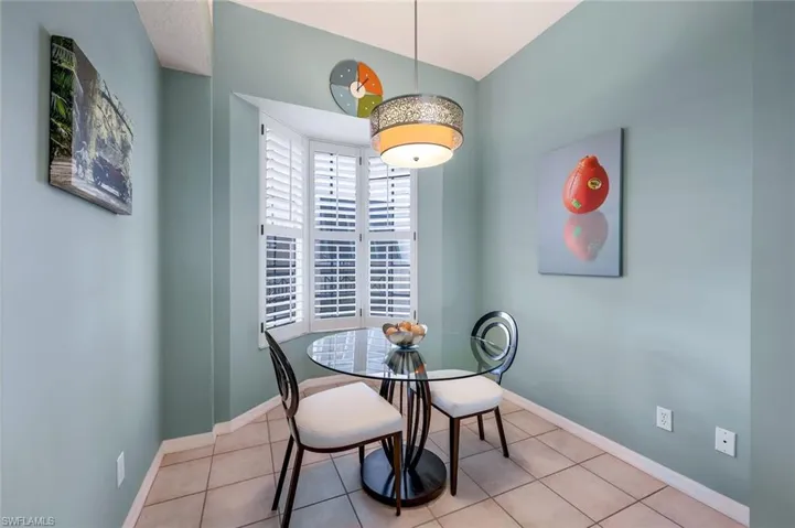 Breakfast and Casual dining   area with light tile patterned floors