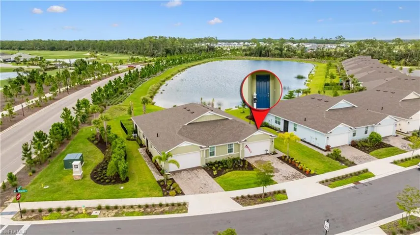 Aerial perspective of suburban area with a large body of water
