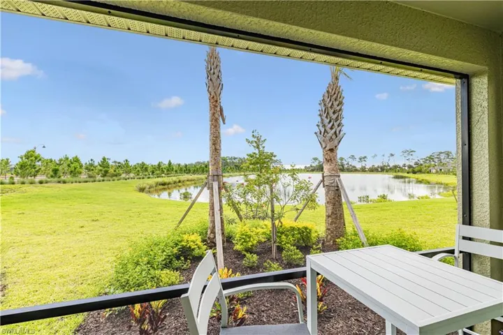 View of grassy yard featuring a water view
