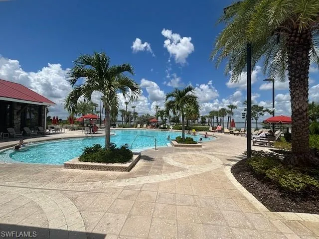 Community pool featuring a patio