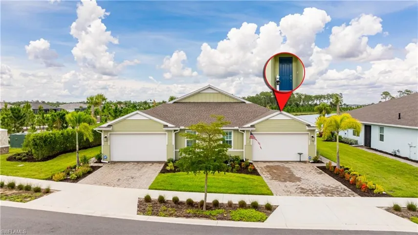 Ranch-style home featuring decorative driveway, an attached garage, and a front lawn
