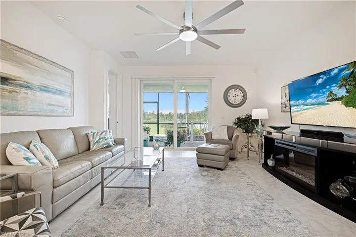 Living room featuring ceiling fan