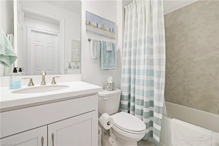 Full bathroom with vanity and shower / tub combo
