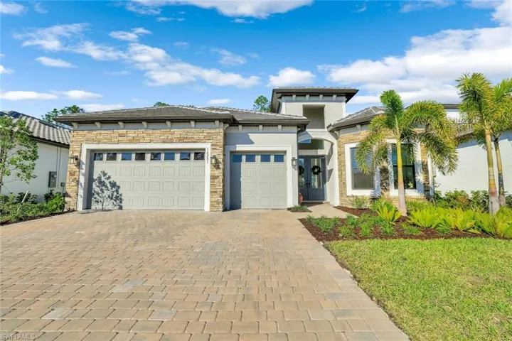 View of the front of the house with a three-car garage