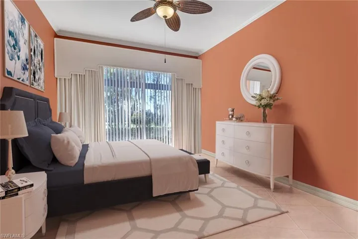 virtually staged Bedroom featuring ceiling fan, light tile patterned floors, and ornamental molding