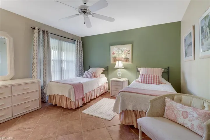 Tiled bedroom with ceiling fan