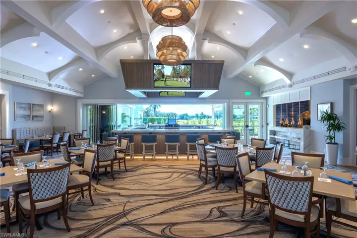 Dining area featuring beam ceiling, high vaulted ceiling, and recessed lighting