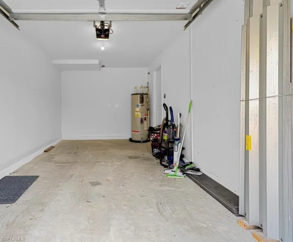 Garage featuring electric water heater