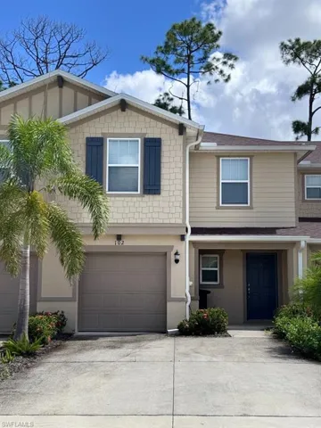 View of front facade with driveway and an attached garage
