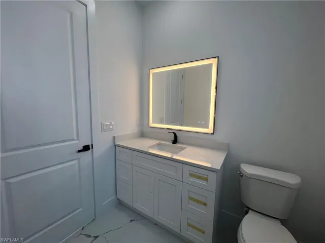 Bathroom with vanity and toilet