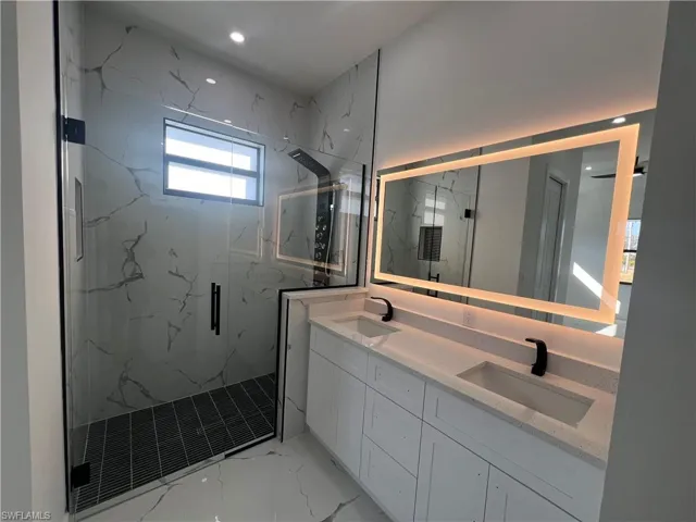 Bathroom with vanity and walk in shower