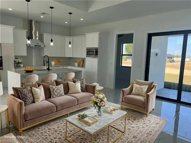 Living room featuring recessed lighting, marble finish floor, and visible vents