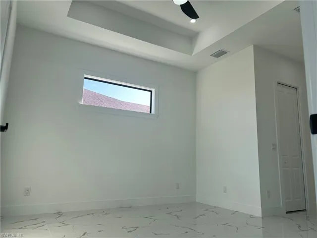 Spare room featuring ceiling fan
