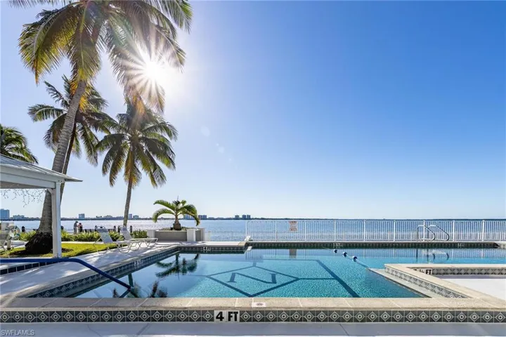 View of swimming pool with a patio area and a jacuzzi
