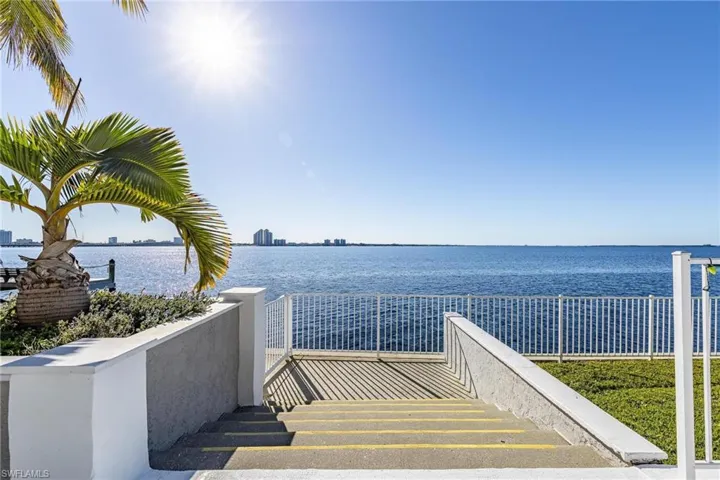Surrounding community featuring a water view