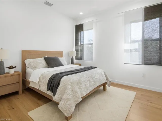 Bedroom featuring light wood finished floors and baseboards