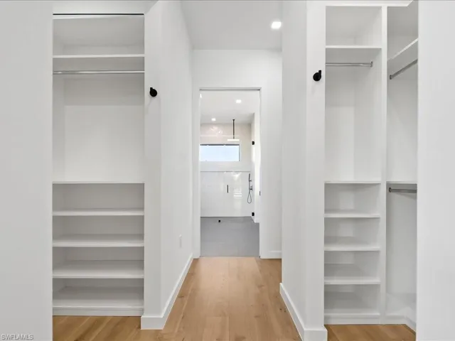 Walk in closet featuring light wood-style floors