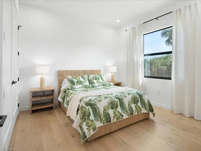 Bedroom featuring light wood-type flooring and recessed lighting