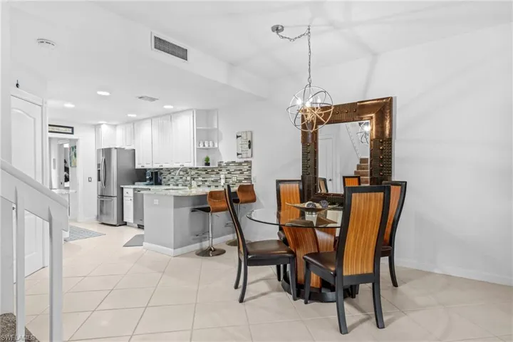Open-concept living space with tiled flooring throughout