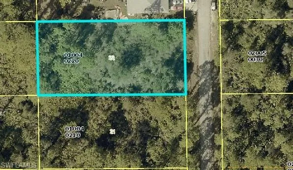 Aerial overview of property's location featuring property parcel outlined