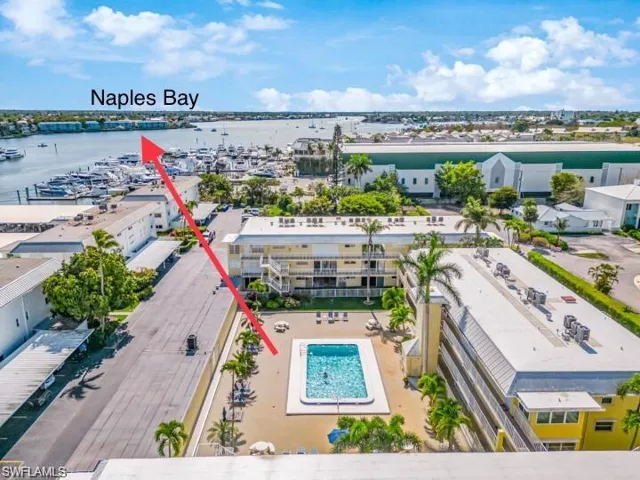 Aerial perspective showcasing a community pool and surrounding buildings