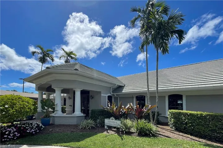 View of front of home featuring stucco siding and a tiled roof