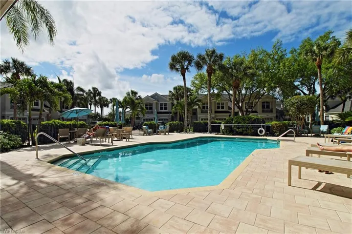 Community pool with a patio area
