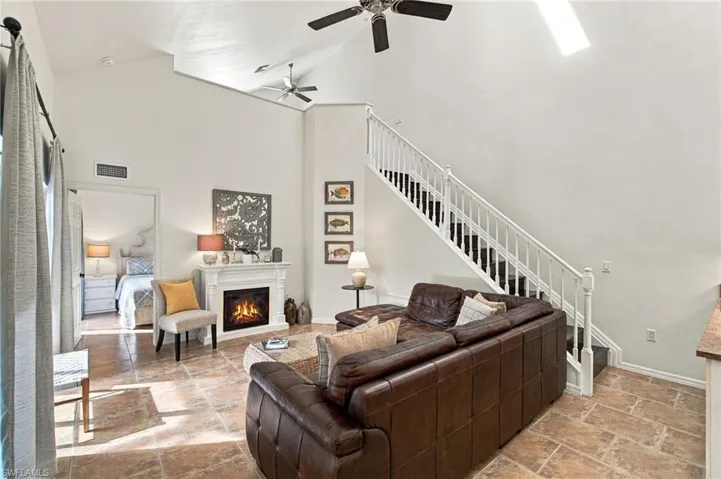 SOARING 22-FOOT VAULTED CEILINGS, skylights and endless windows cover the open floor plan in natural light!