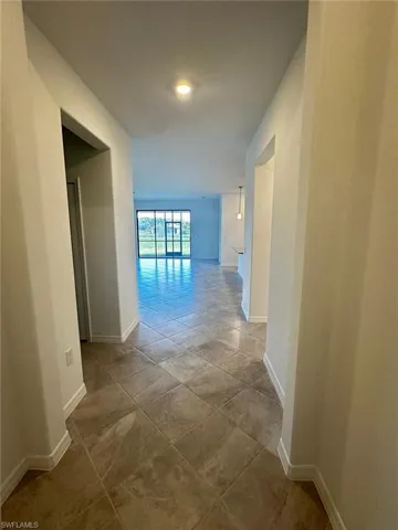 Hall featuring baseboards