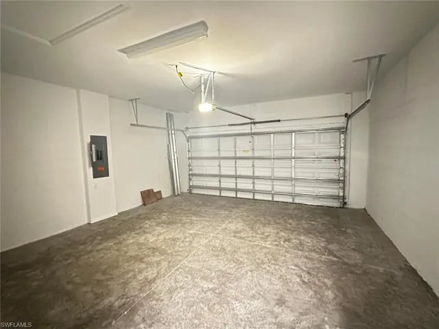 Garage featuring electric panel