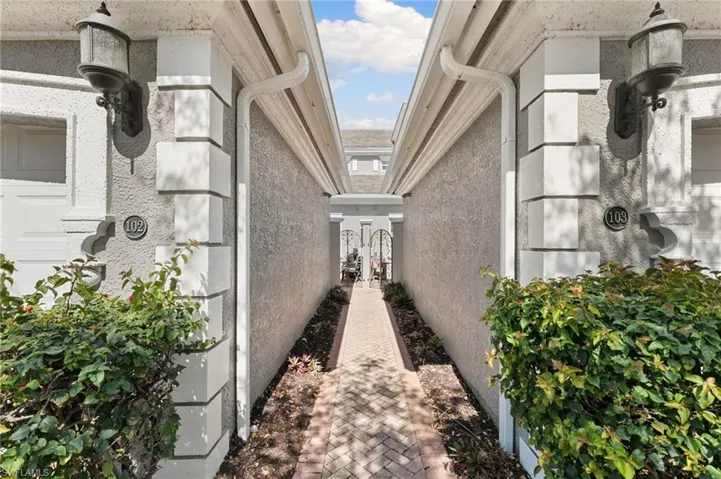 View of side of home featuring stucco siding