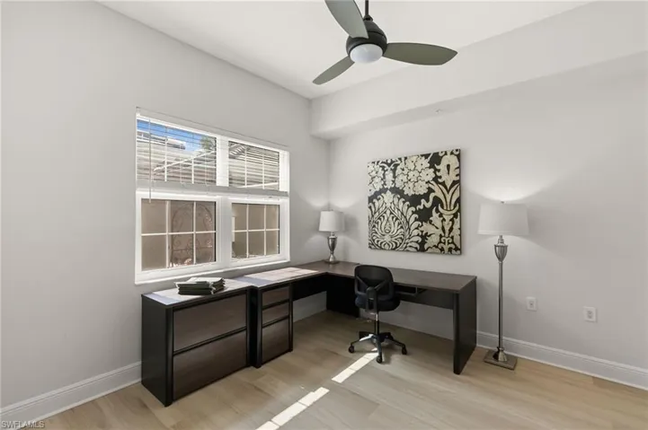 Office space featuring light wood finished floors and a ceiling fan