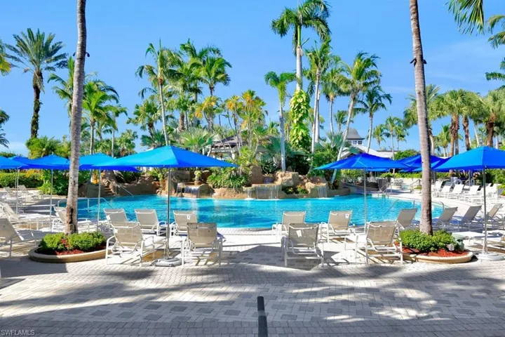 Community pool with a patio