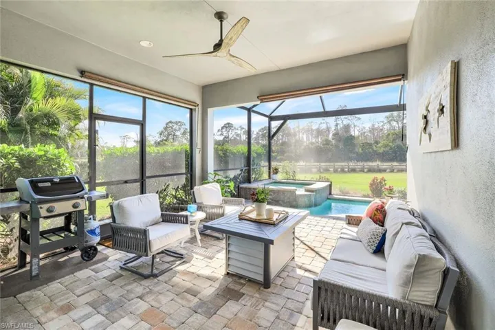 Sunroom / solarium featuring ceiling fan