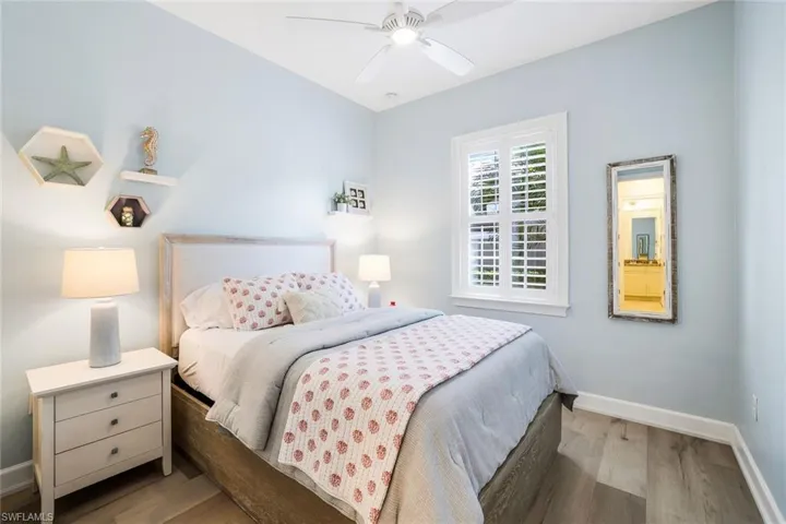 Bedroom with hardwood / wood-style flooring and ceiling fan