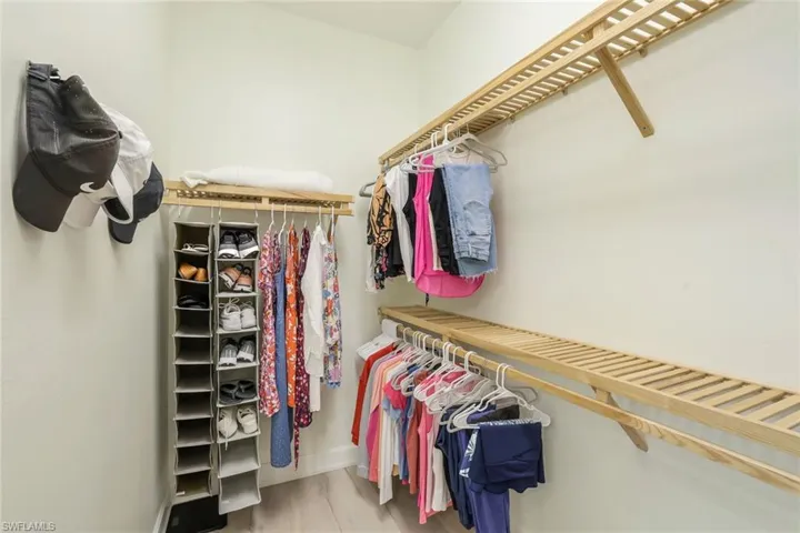 Walk in closet featuring hardwood / wood-style flooring