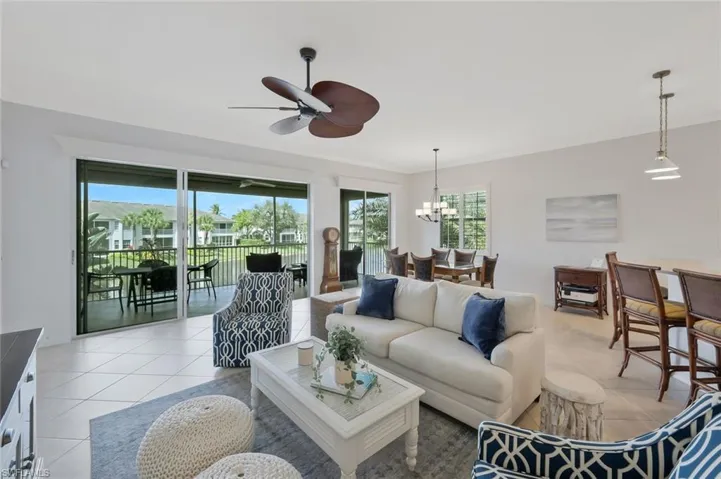 Spacious living room with soaring ceilings, abundant natural light, and an open design that creates an inviting space for relaxing or entertaining.