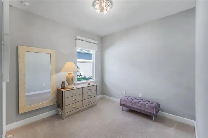 Living area featuring light colored carpet