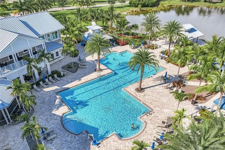View of swimming pool featuring a water view and a patio area