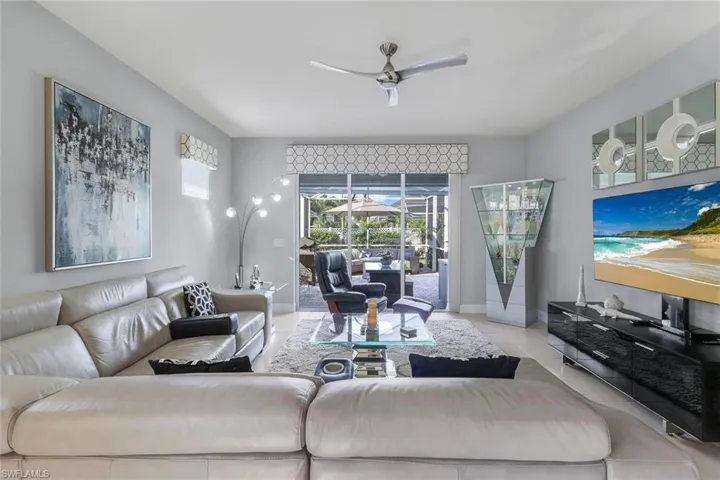 Tiled living room with ceiling fan
