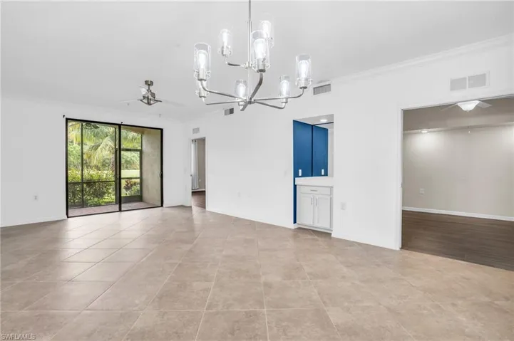 Living room with dry bar unfurnished