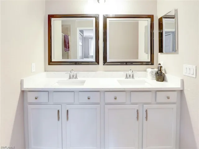 Bathroom featuring dual vanity