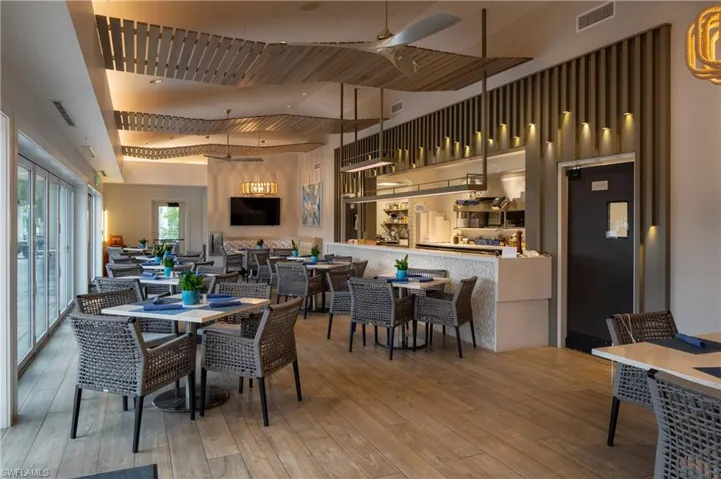 Dining area featuring a ceiling fan and hardwood / wood-style floors