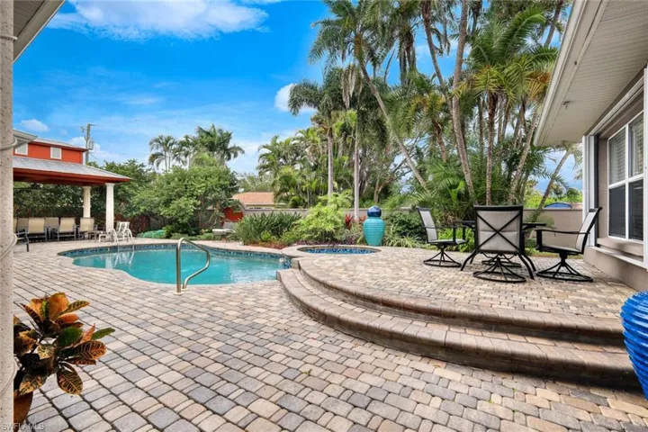View of pool featuring an in ground hot tub and a patio